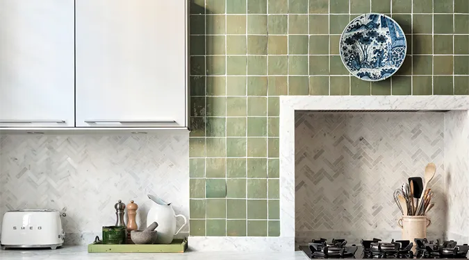 Green kitchen wall with zellige tiles